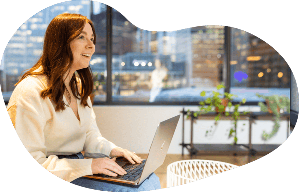 Female Jiminny employee working in shared working space in London