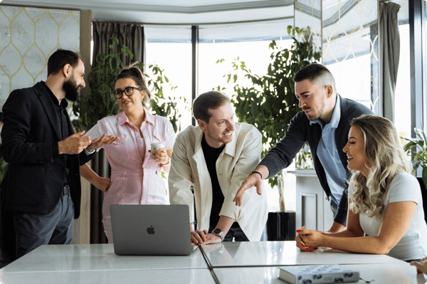 A team discusses a sales enablement strategy during a meeting in a bright office